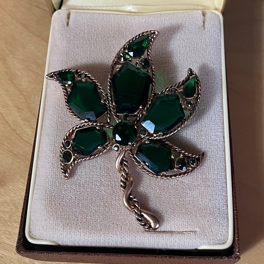 Vintage maple leaf brooch with emerald green glass pedals.